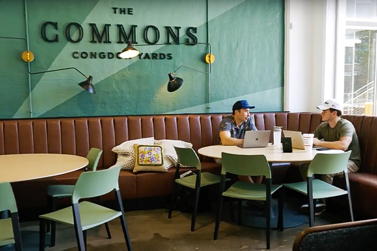 2 Men in a cafe with laptops